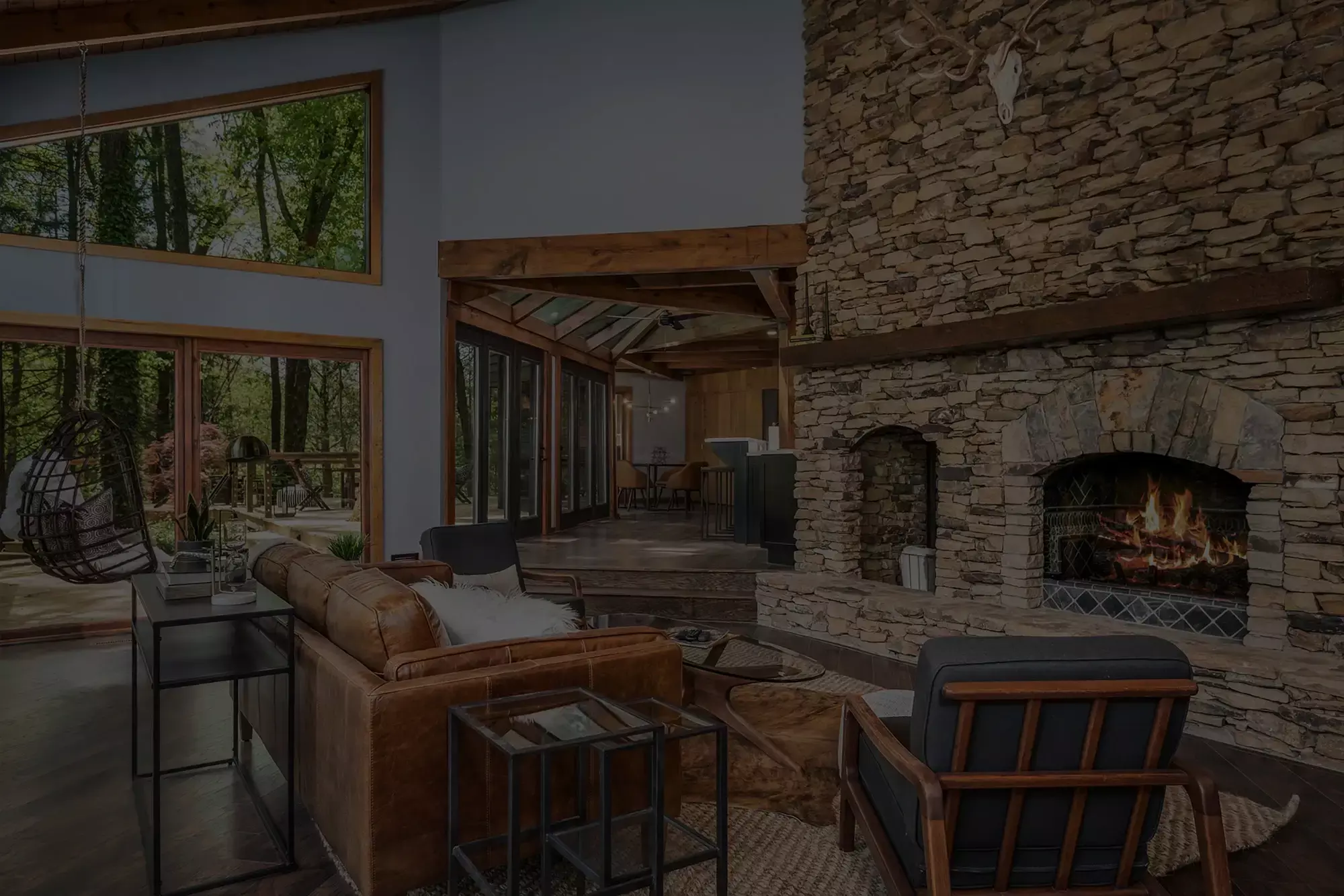living room with stone fireplace